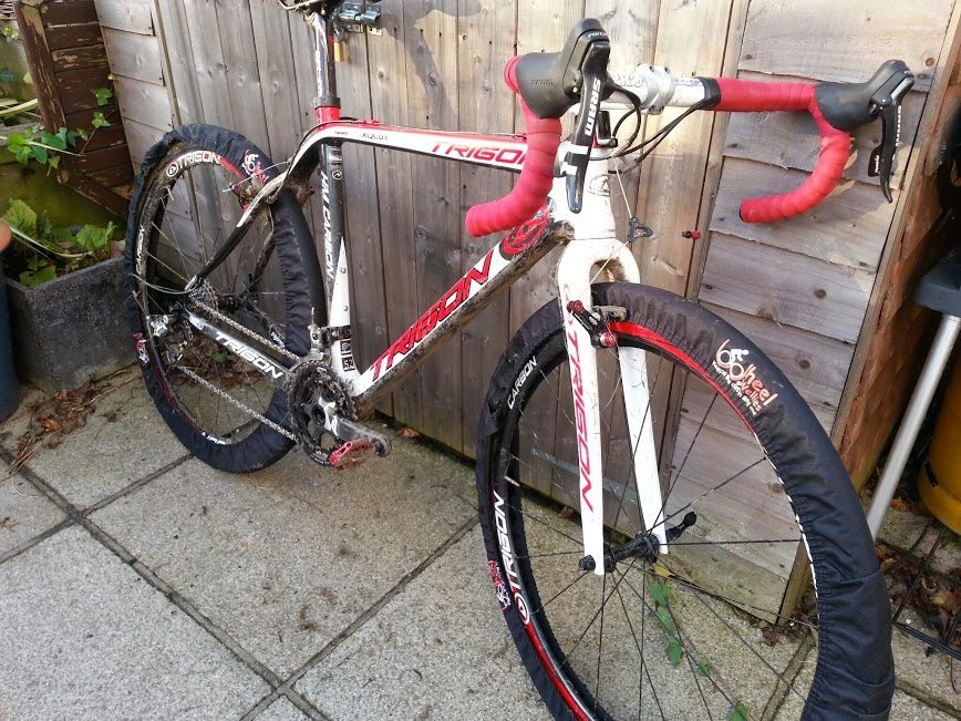 Wheel Wellies fit over wheels even when they are in the frame