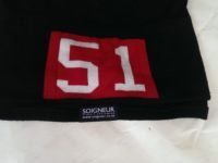Soigneur's own logo is small and discreet