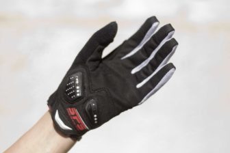 Gloves are a tight fit and require a hard pull to get them on