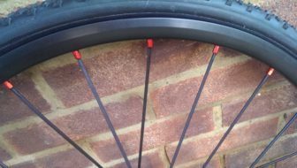 Red anodised nipples seat aluminium spokes into the rims
