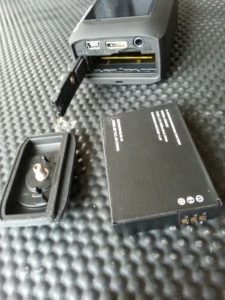 Battery slides into its slot and has its own hatch