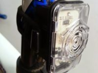 The lens is made from Lexan, a tough polycarbonate used to make the helmet visors of the Apollo moon missions