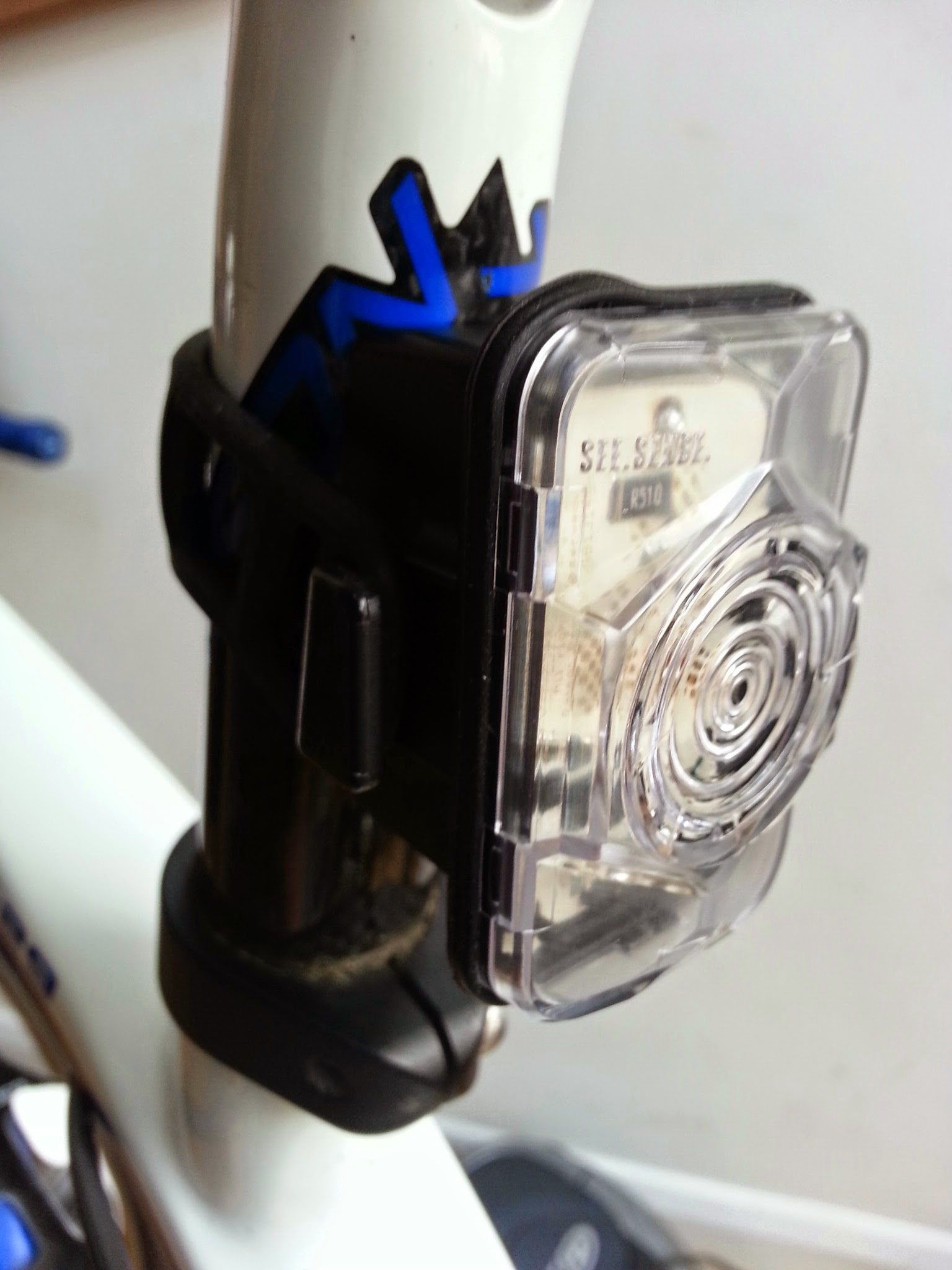 The lens is made from Lexan, a tough polycarbonate used to make the helmet visors of the Apollo moon missions