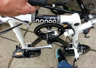 To unfold you simply push the rear wheel with your foot...