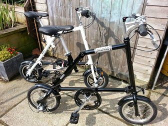 Black Nanoo has traditional spoked wheels as opposed to the cast wheels on the white 12"