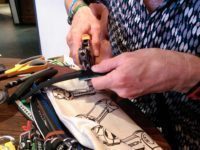 New holes are punched in a standard belt...