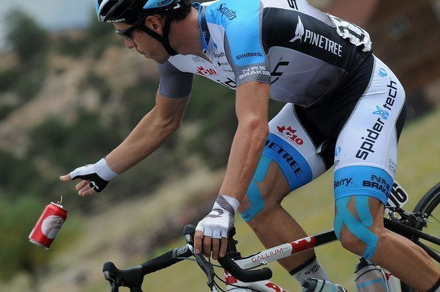 That blue tape is called Kinesio tape (photo courtesy of SpiderTech https://www.flickr.com/photos/teamracepro/)