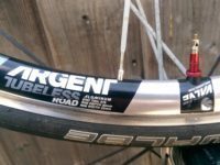 Silver Argent rims come with red Amercian Classic valve stems