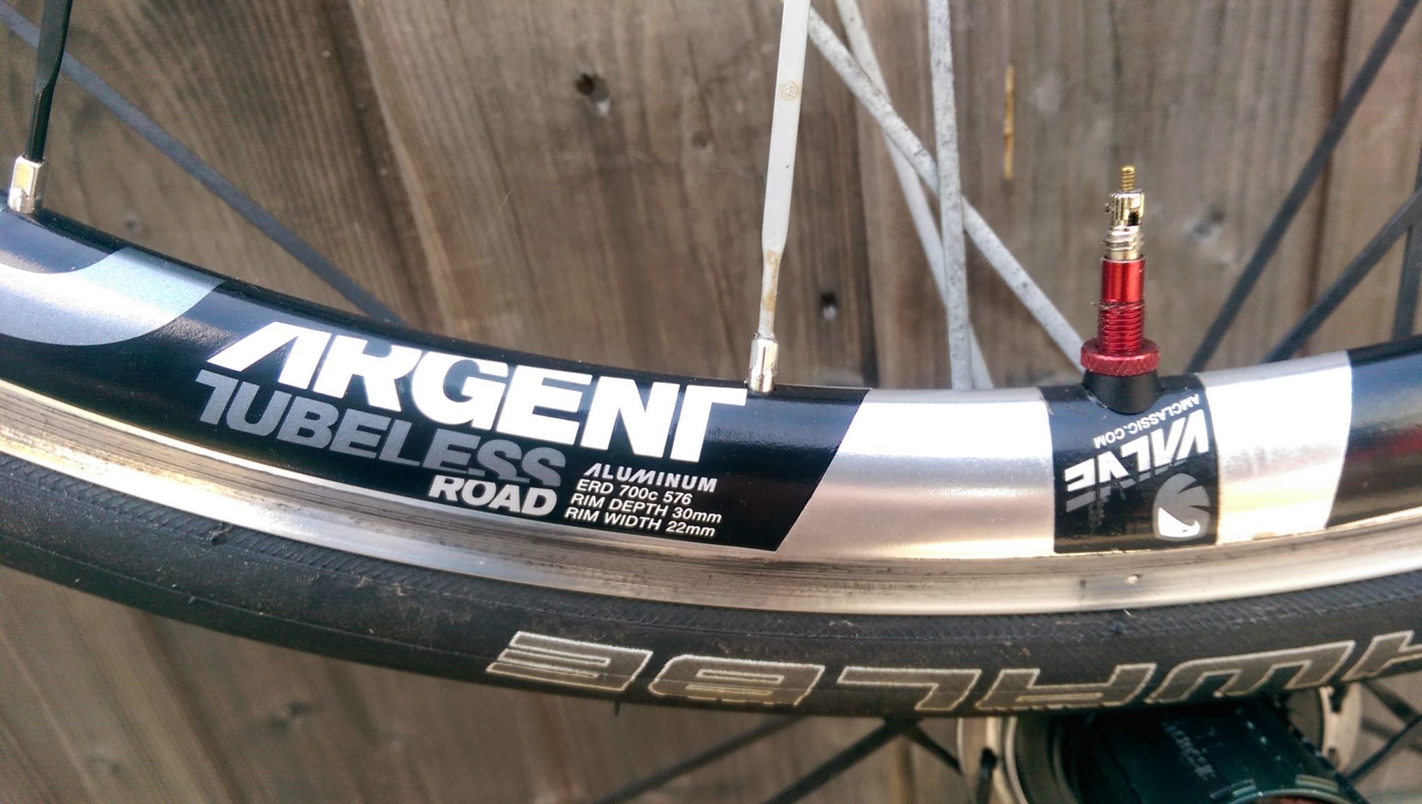 Silver Argent rims come with red Amercian Classic valve stems