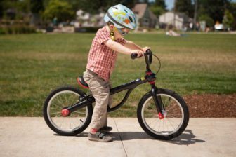 The Kundo bike is aluminium, extremely light, has a handbrake and a pedal kit that lets you add pedals when you are ready