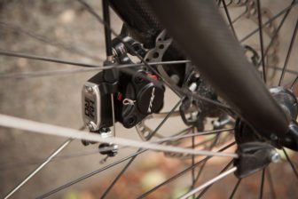 A cable pulling on a lever operates the hydraulic piston, simple and will work with standard road levers