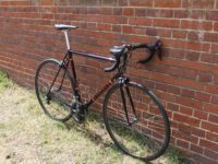 The Malcolm Custom Bicycles’ Custom Steel Frame loiters, waiting to show off it's old school ride