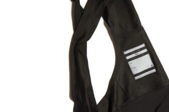 A radio pocket is provided on the rear of the bib