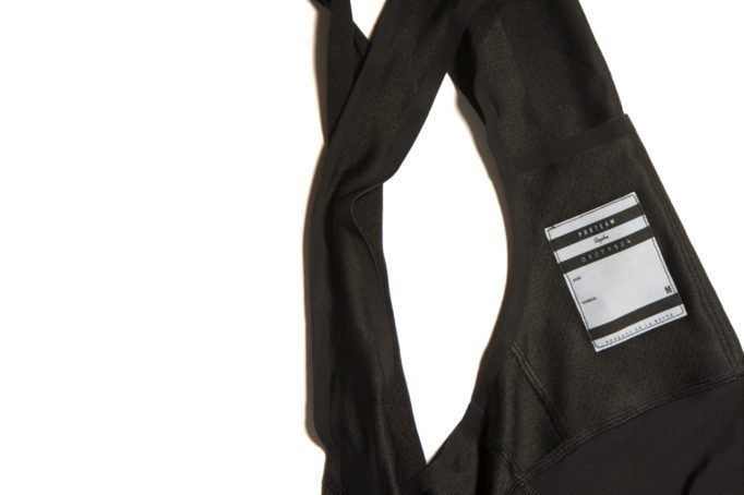 A radio pocket is provided on the rear of the bib