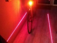 The standard LED light is plenty bright enough to be seen with, the lasers are to encourage other road users to give you some space