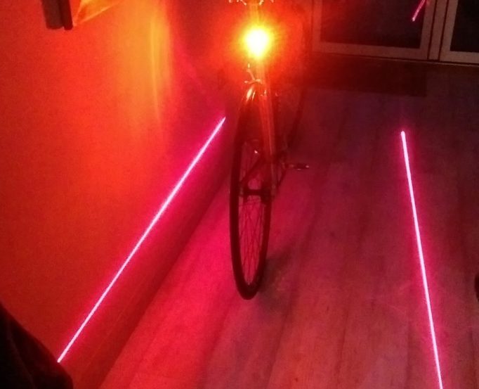 The standard LED light is plenty bright enough to be seen with, the lasers are to encourage other road users to give you some space