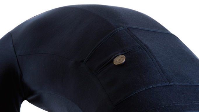 Svelte's signature brass button helps keep your valuables safe and looks good