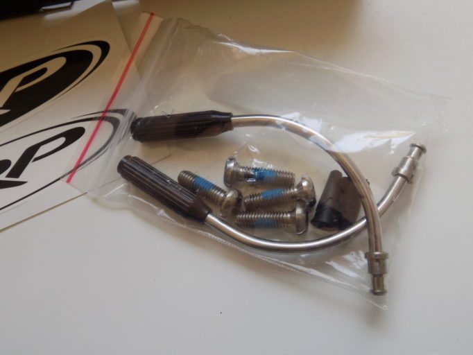 Titanium bolts and hardware keep the weight down, while a barrel adjuster on top of the noodle makes cable adjustments easier