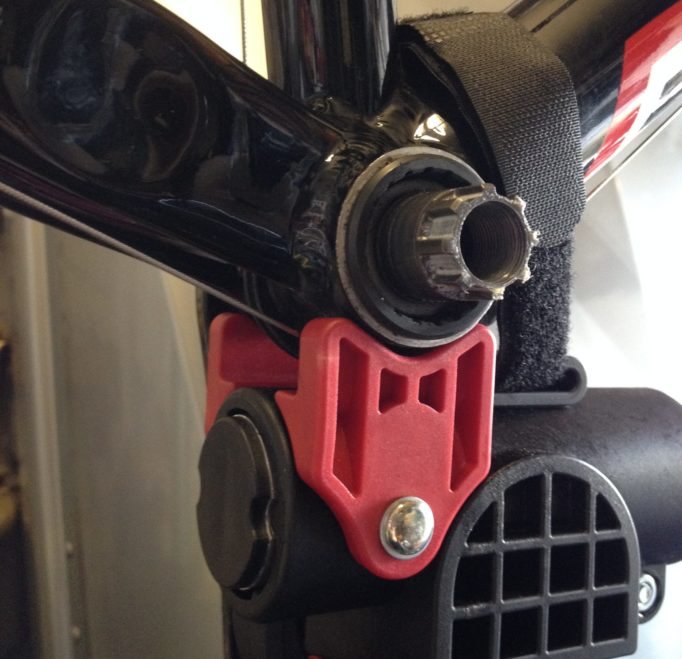 A velcro strap holds your pride and joy in place on top of the red BB rest