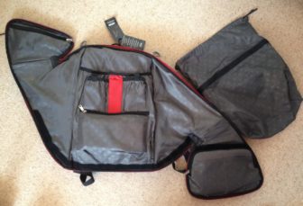 The unusual closure used in the Lumos Aster, allows it to wrap around the contents. You can also see the internal pockets and shoe bag here