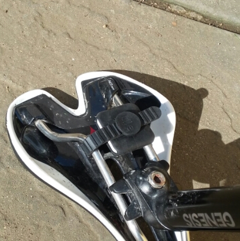 You can use the provided strap or glue it into place