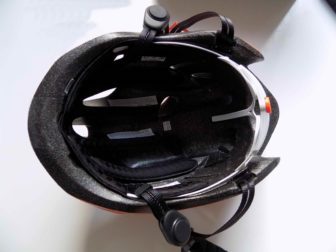 The bone conduction 'pods' sit on the straps next to your ear.