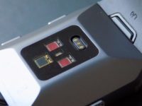 Around the back are three optical sensors and a magnetic charging port