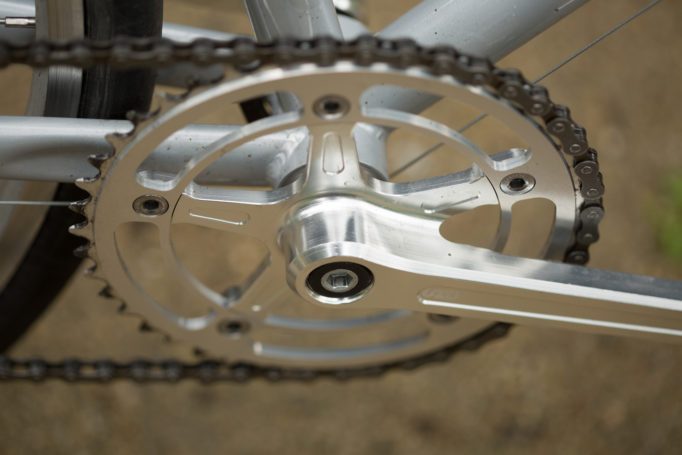 angled side shot of the State Bicycles 4130 CNC machined crank with an out of focus background.