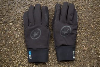 Assos Ultraz Winter Gloves on a wet gravel background
